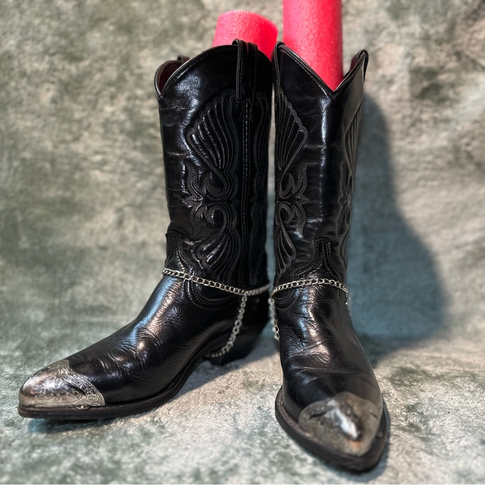 Vintage black leather cowboy boots with metal toe tips